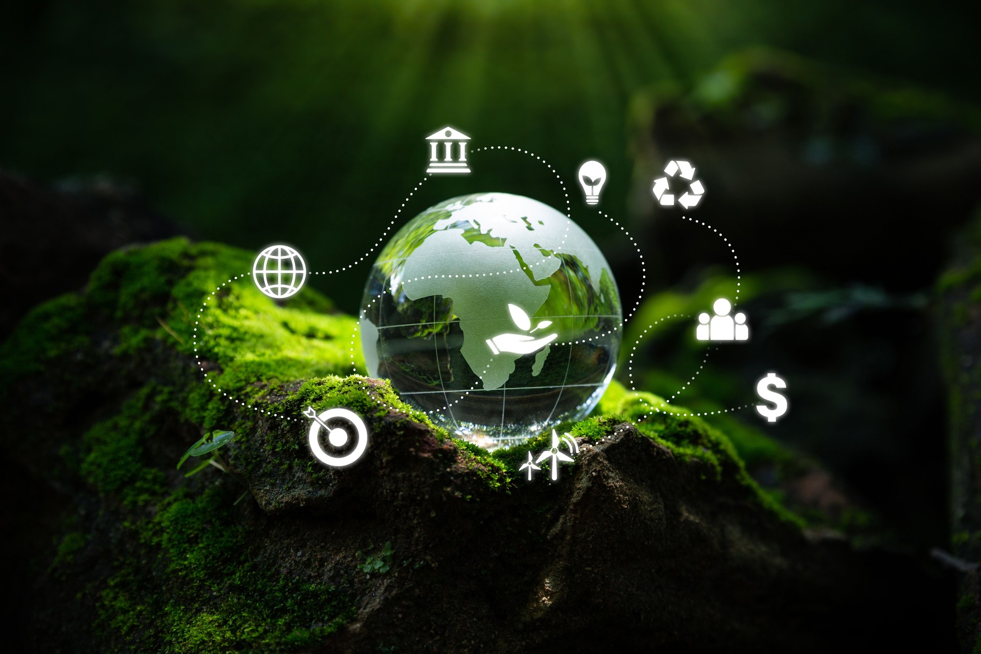 Crystal globe putting on moss with ESG icon.